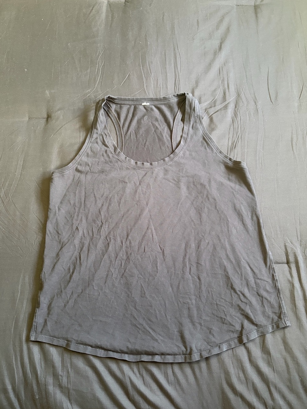 Black Lululemon tank top. Size tags has been removed. Most likely size 12/14.